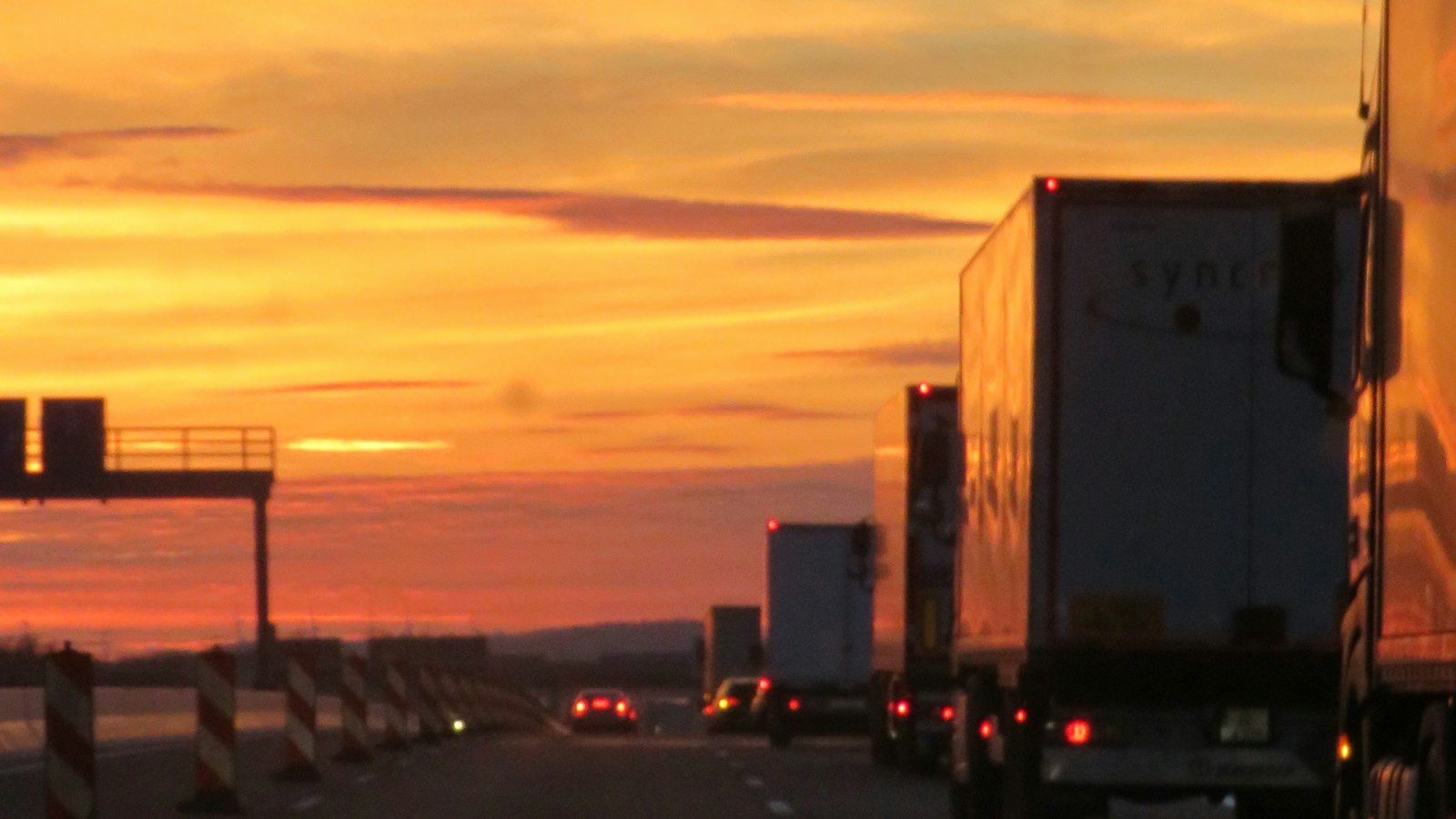 Semi truck on the highway at sunset, kept loaded by a remote truck dispatcher